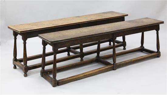 A pair of early 18th century style oak long stools, W.5ft 6in. D.1ft 2in. H.1ft 9in.